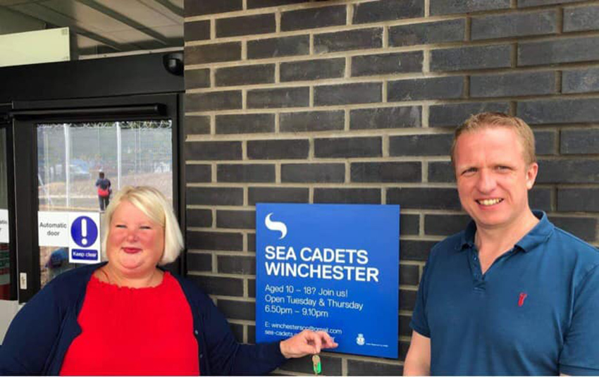 Two volunteers stand outside Winchester's new unit