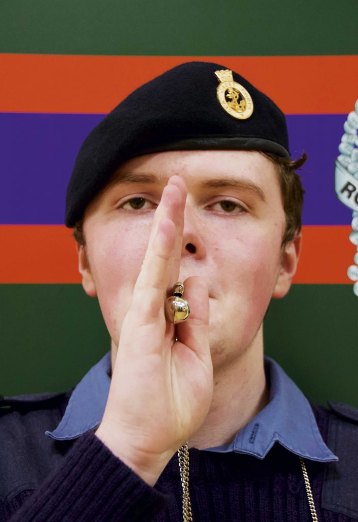 Jonas's winning photo shows a cadet playing the bosuns call and looking into the camera