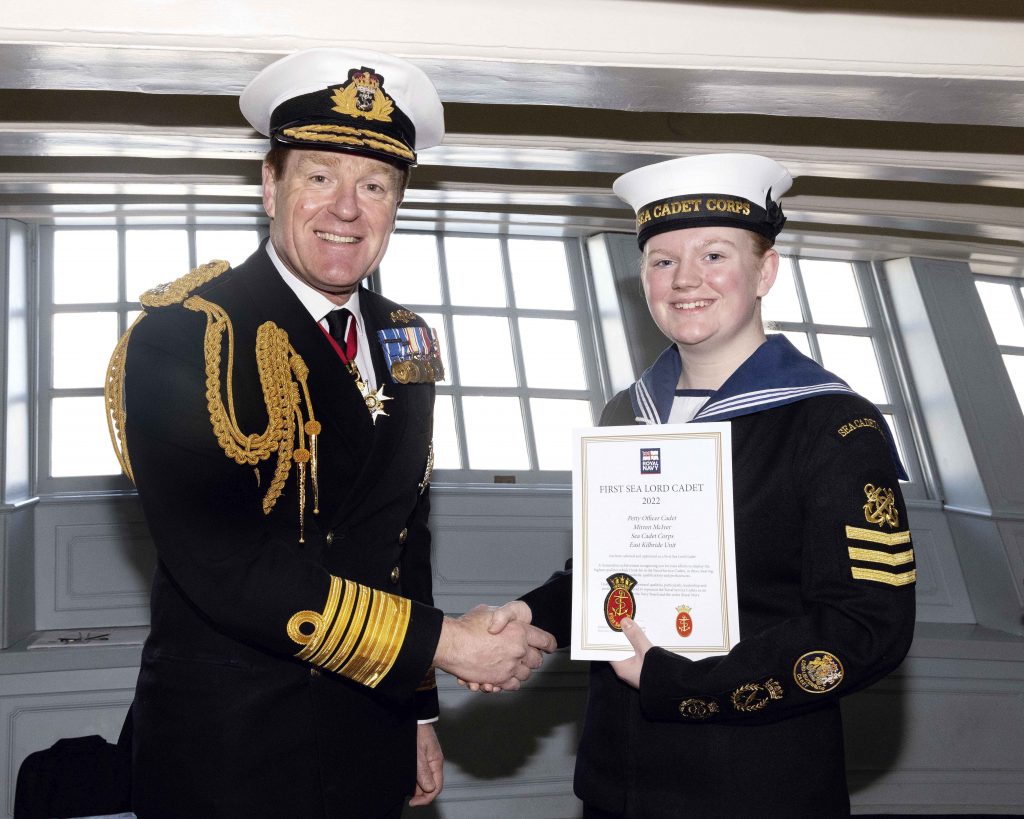 Mirren accepts her certificate from the First Sea Lord