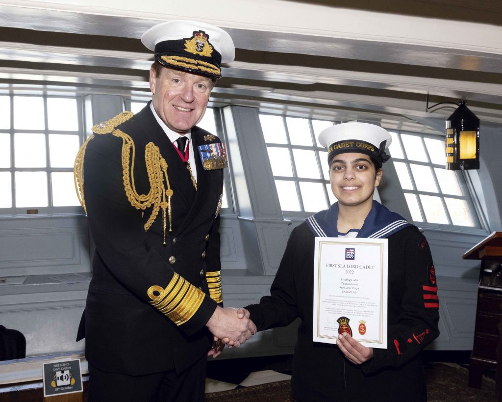 Zunara accepts her certificate from the First Sea Lord