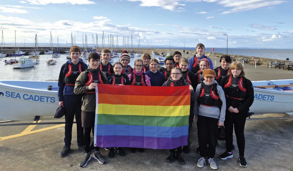 Musselburgh Sea Cadets hold up their Pride flag