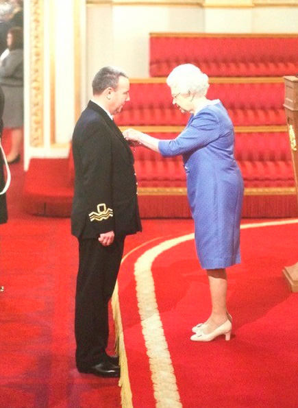 Ian Wilson receives his medal from The Queen
