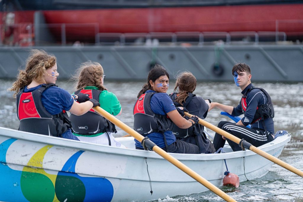 A group of cadets rowing