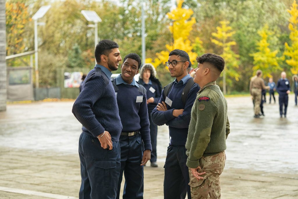Cadets laugh and talk together during a break outside at cadet conference