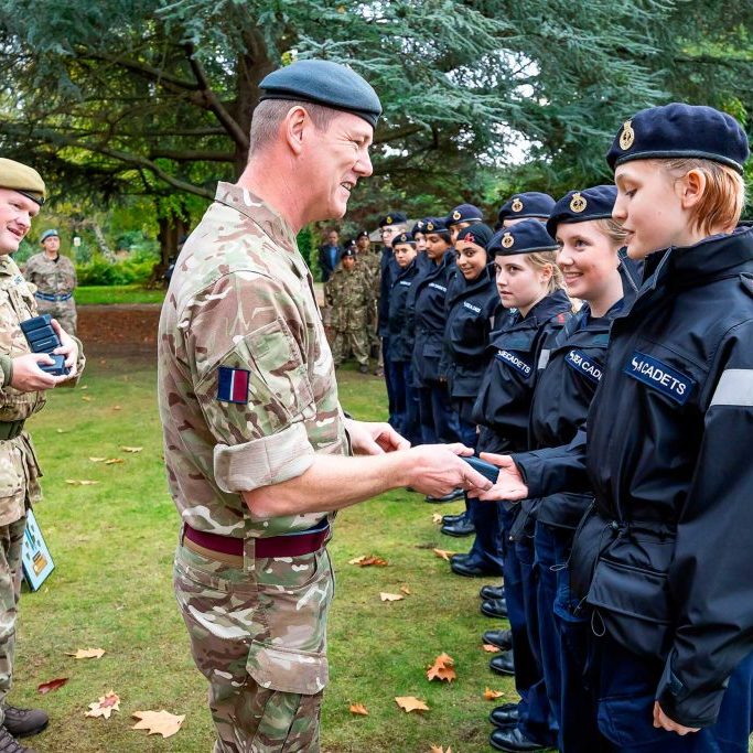 Rickmansworth Unit being presented with their Elworthy Trophy medals