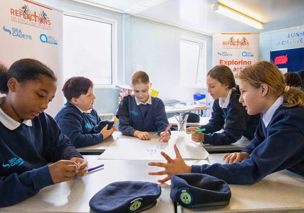 Junior sea cadets exploring ideas for work on their own creative projects